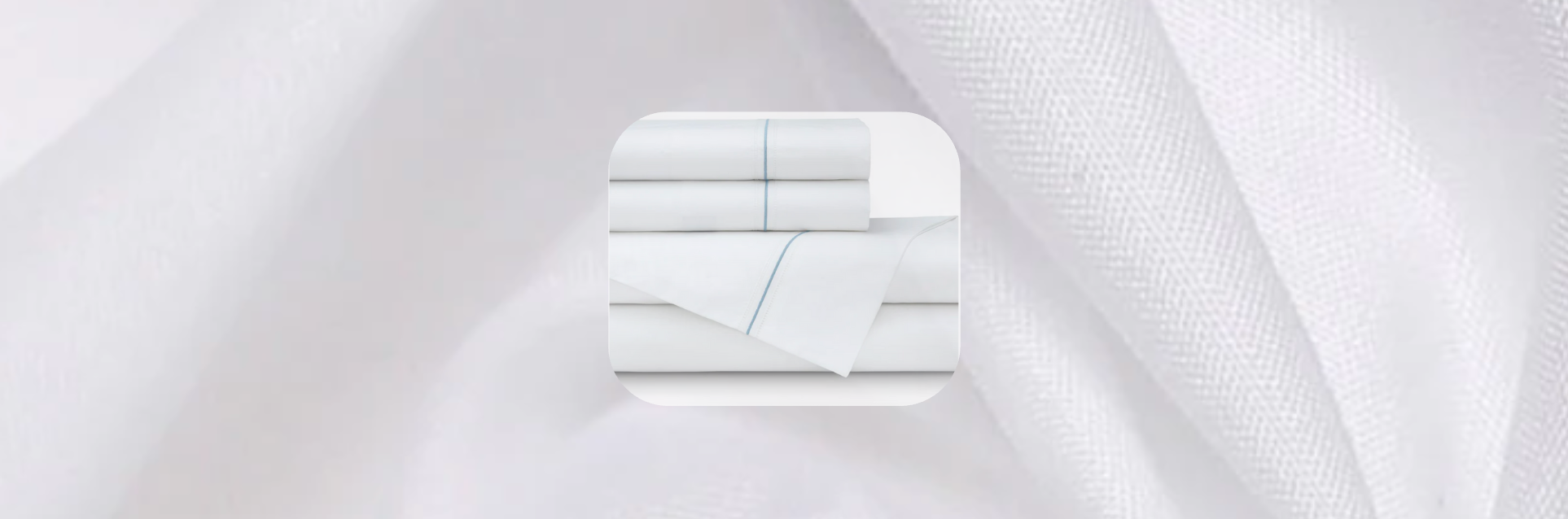 White bed sheets with light blue embroidered single-line detail, neatly folded and displayed on a soft white textured background