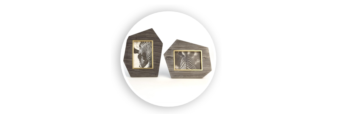 Set of two geometric wood photo frames with gold-trimmed openings, featuring black and white zebra prints, displayed on a white background
