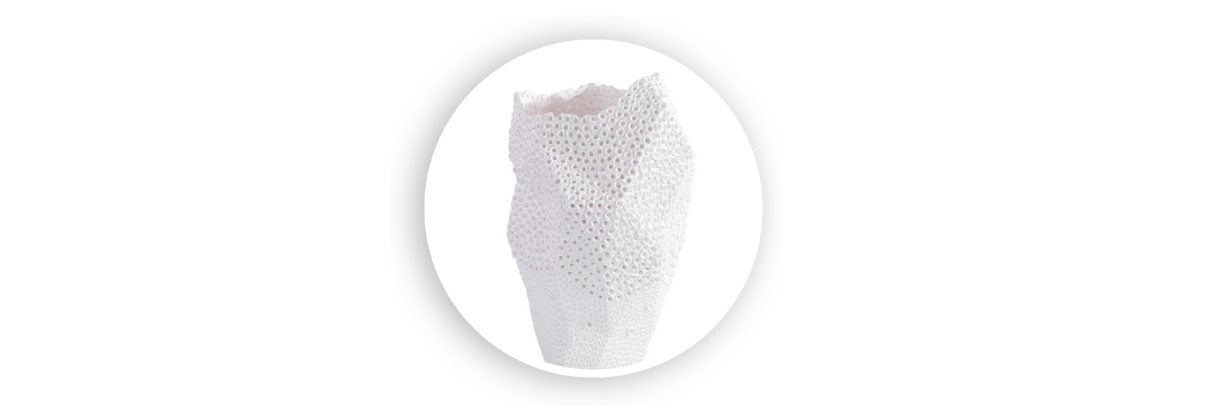 White ceramic vase with a honeycomb texture and asymmetrical sculptural shape, displayed on a clean white background