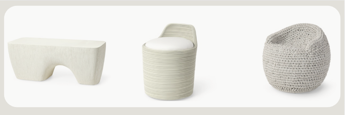 Three modern outdoor seating pieces in neutral tones. From left to right: a sculptural bench with a curved cutout base, a textured round stool with a cushion, and a cozy woven pouf-style chair with a rounded back.