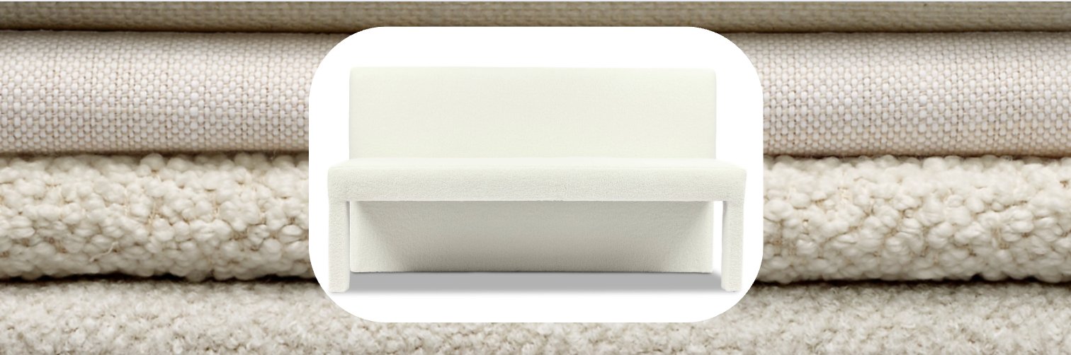 Modern white dining bench with clean lines and upholstered seat, displayed against stacked neutral fabric textures including boucle and woven linen